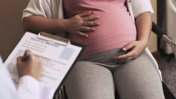 Pregnant Woman and Gynecologist Doctor at Hospital