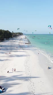 Tanzania  Vertical Video Kitesurfing Near the Shore of Zanzibar Slow Motion