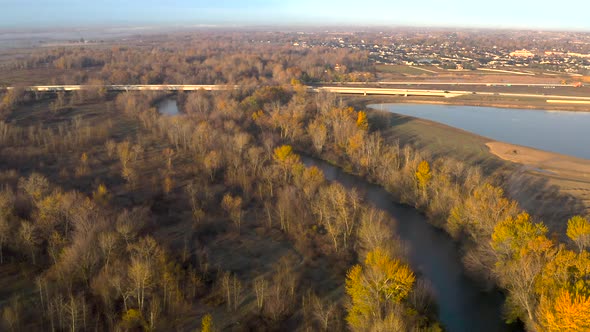 High up aerial shot of Boise River flowing through Idaho's beautiful landscape.