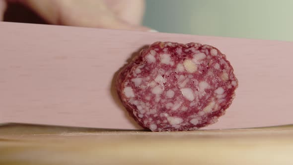 Sausage Slicing Close View Woman Hand's Cutting Sausage with Sharp Knife