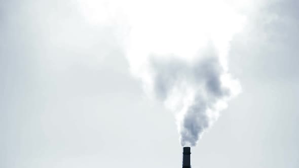 Large Pipe of Smoke Pipe Thermal Power Plant in Light on a Sunny Day