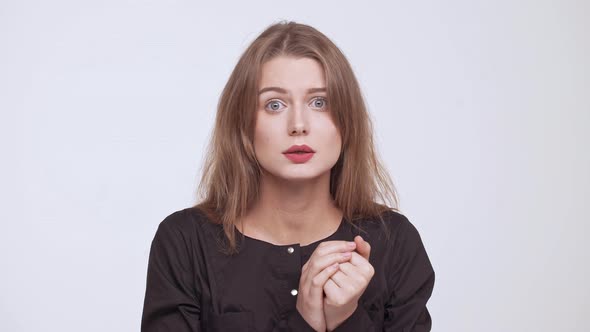 Young Beautiful Upset Disagreed Fairhaired Girl Over White Background