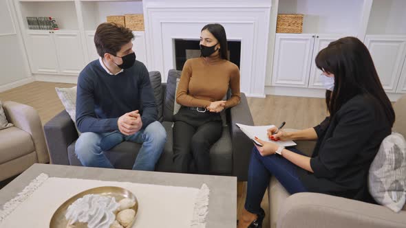 Couple Visiting Psychologist In Face Mask