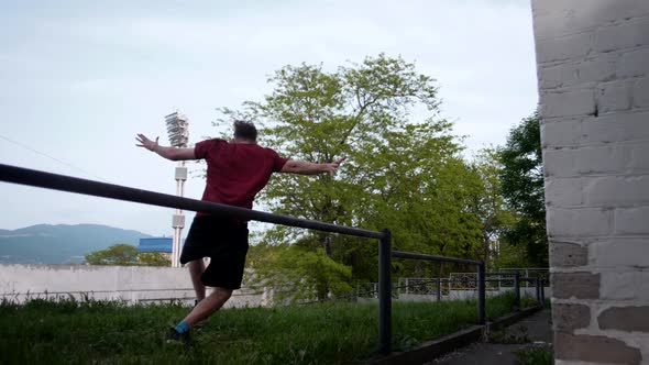 Parkourist freerunner makes a bunch of spectacular elements on the street