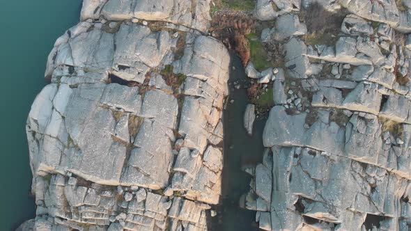 Reveal House in Rural Coastal Cliff Landscape Top View Aerial