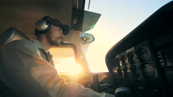 Male Pilot in a Plane Cockpit Close Up
