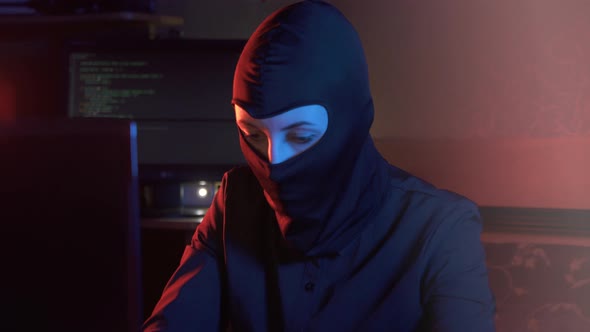 Girl in a Balaclava at a Computer Types