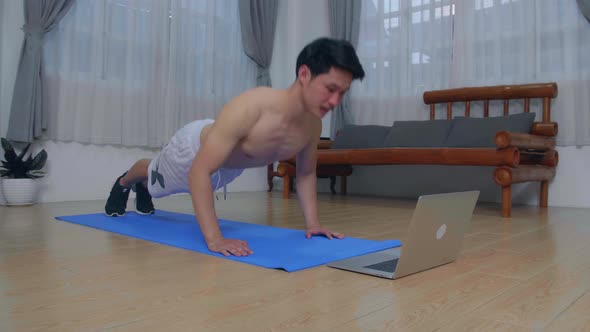 Man Is Doing Push Ups At Home