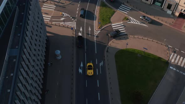 Birds Eye View of Cars Driving in Street of City