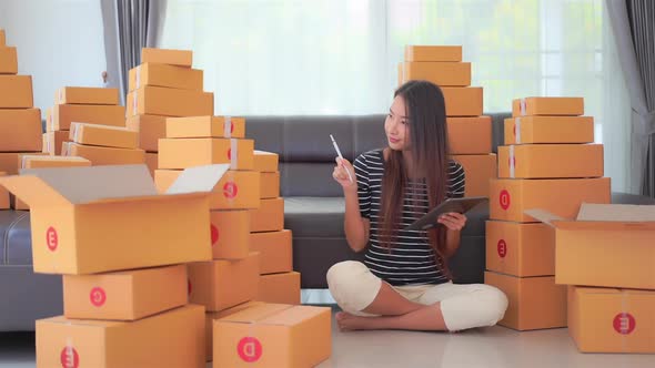 Woman with packing box ready for shipping