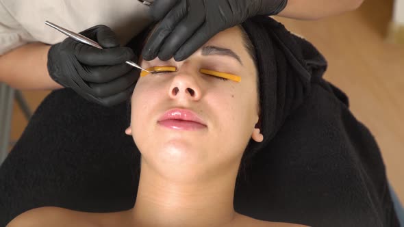 A Beautiful Girl in a Beauty Salon Does a Lamination Lashes