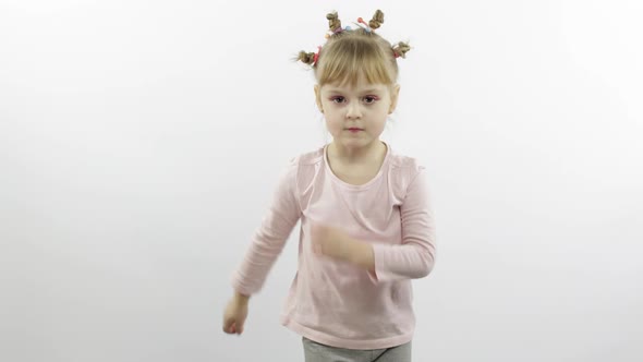 Positive Girl in Pink Blouse Dancing. Happy Four Little Child. White Background