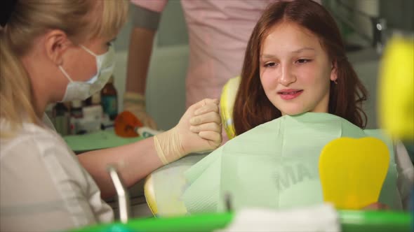 A Dentist Tells What He Will Do with the Teeth of a Patient at a Private Clinic