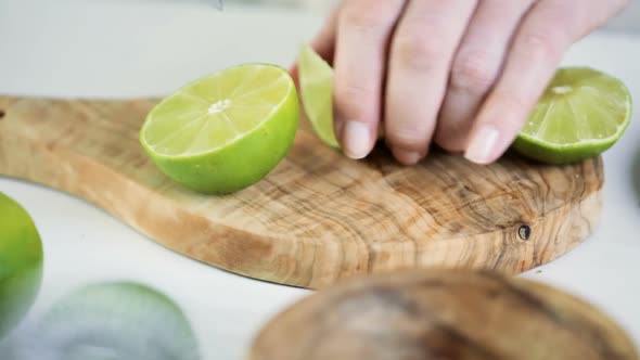 Slicing lime for key lime margarita.