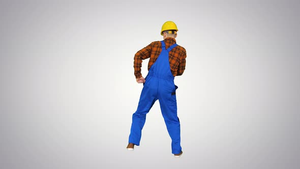 Construction Worker in Helmet Dancing on Gradient Background.