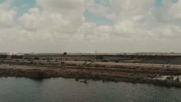 Aerial View Of Rural Road Beside River In Sindh, Pakistan. Parallax View