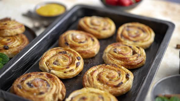 Fresh Baked Cinnamon Buns on Black Iron Tray