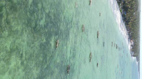 Vertical Video of the Ocean Near the Coast of Zanzibar Tanzania Aerial View