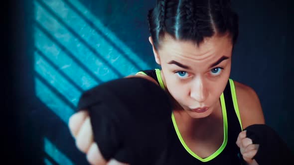 Female boxer practicing in gym