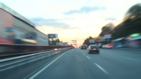 Dusk Driving Time Lapse Through City, Cars With Lights