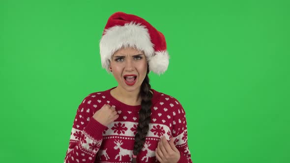 Portrait of Sweety Girl in Santa Claus Hat Angrily Pointing Herself, Saying Who Me No Thanks i Do