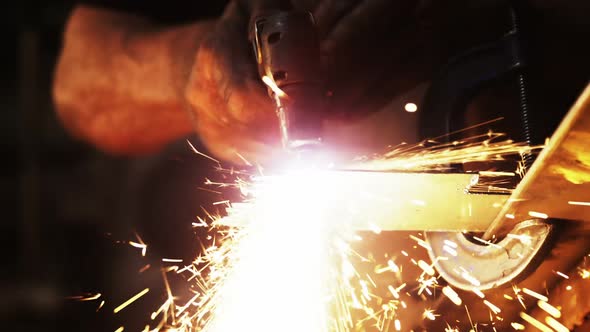 Mid-section of welder using welding torch