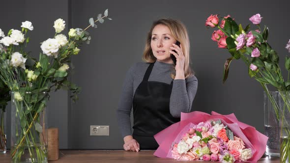 Florist Informs Customer About Composed Flowers Bouquet
