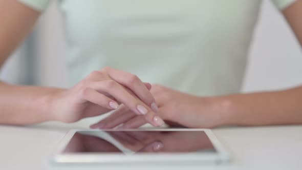 Close Up of Female Hands Using Tablet Typing