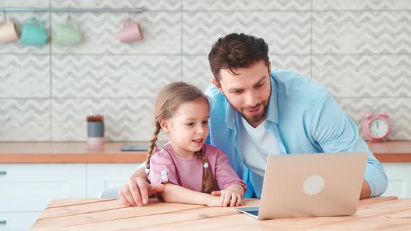 Young family with a child talking using a microphone and webcam