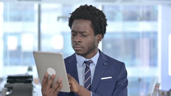 Handsome African American Businessman Get Shocked on Tablet