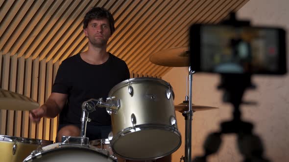 Drummer Man Plays Online and Records Video on Smartphone