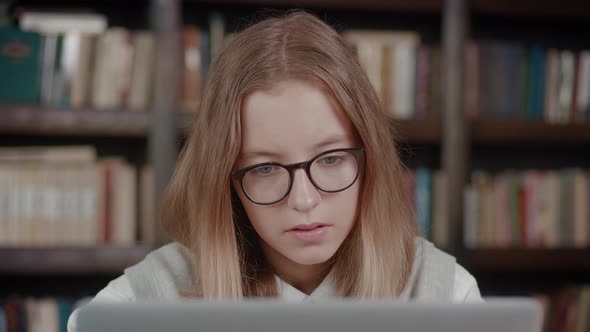 Little Schoolgirl Looking at Laptop Screen Reading Email with Unexpected Amazing News Celebrating