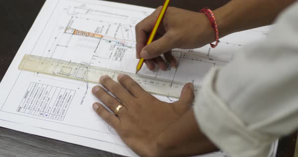 Architect Working On Blueprint alt