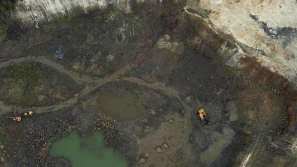 Aerial view basalt quarry of open pit with Bulldozer And Car