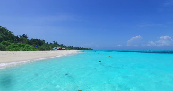 Beautiful birds eye island view of a white sand paradise beach and aqua blue water background in col