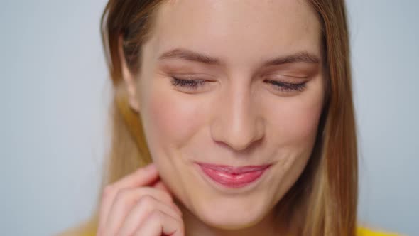 Closeup Positive Woman Sending Air Kiss to Camera on Grey Background