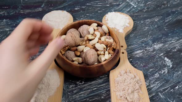 Various Gluten Free Flour on a Black Table with Nuts