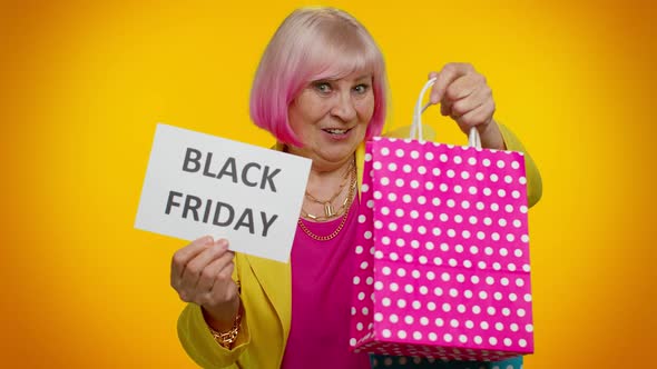 Elderly Granny Woman Showing Black Friday Inscription Banner Text Advertising Discounts Low Prices