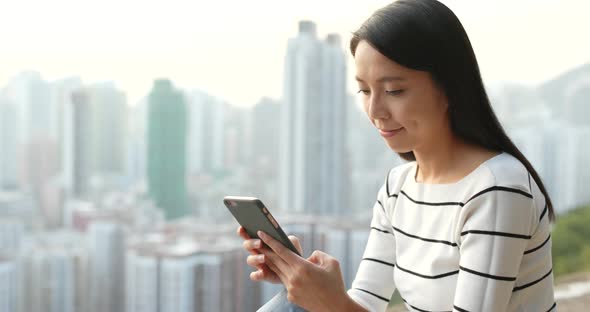 Woman Use of Mobile Phone in City