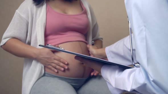 Pregnant Woman and Gynecologist Doctor at Hospital