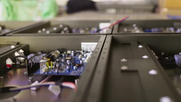 Slider Shot of a Metal Components and Microcircuits in Workshop Laboratory