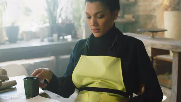 Woman Is Working In Pottery Studio