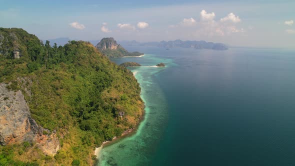 aerial landscape panning right across Ko Kai Island and Ko Poda in the distance surrounded by stunni