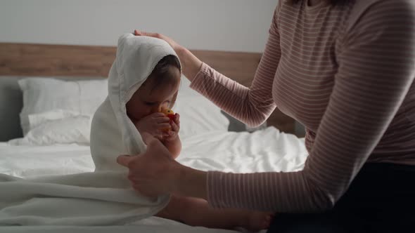 Video of cute caucasian baby after the bath. Shot with RED helium camera in 8K.