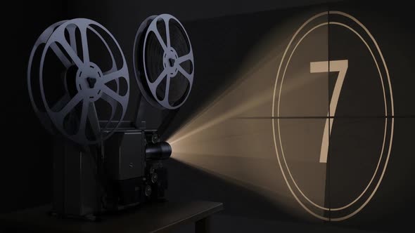 Movie Projector with Film Reel Plays the Retro Countdown Video on the Screen