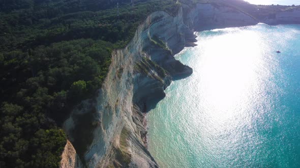 Flight over high cliffs of sea coast, aerial view. Aerial drone video of iconic white rock steep cli