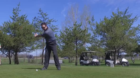 golfer slow motion driving the ball