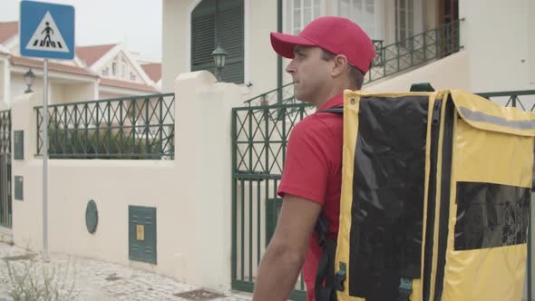 Male Courier Delivering Food