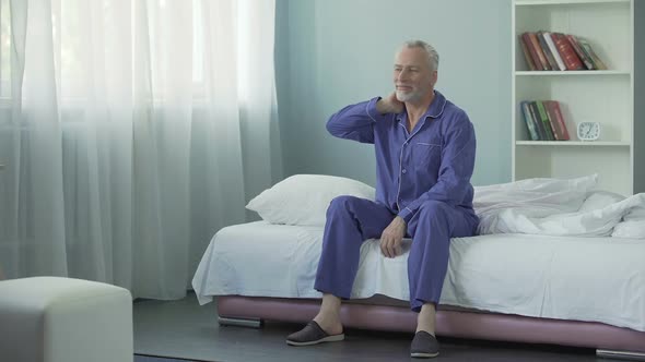 Waking up full of energy and optimism cheerful old man doing morning gymnastics