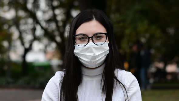 Woman in City Face Portrait Wearing a Protective Mask